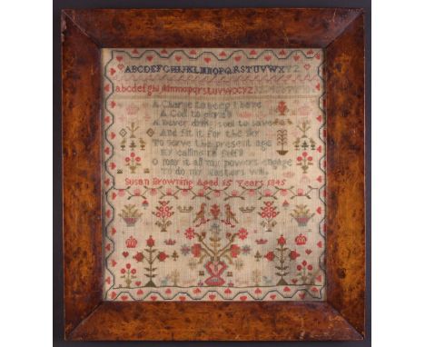 A Victorian Sampler worked by Susan Browning aged 15 years, and dated 1845, with alphabet above verse, birds, potted plants, 