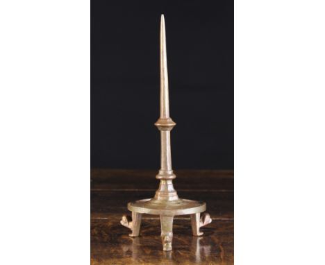 A Gothic Pricket Stick Circa 1400. The spike with hexagonal knop leading down to a ring turned circular tray base raised on t