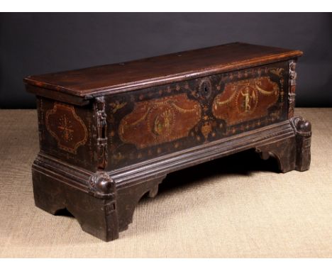 A Fine 17th Century Italian Cassoné. The thick plank top with a moulded edge above carved figural pilasters flanking the fron