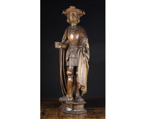 A Fine 16th Century Brussels Carving of Man wearing a plumed hat and cloak over armour, with a pendant hanging from chain aro
