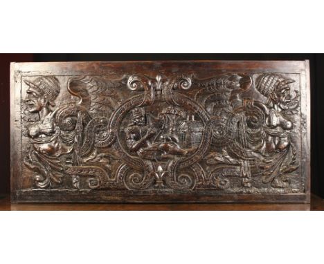 A Relief-carved Panel depicting King David playing a lyre, reclining in a guilloche banded cartouche flanked by harpies, 20 i