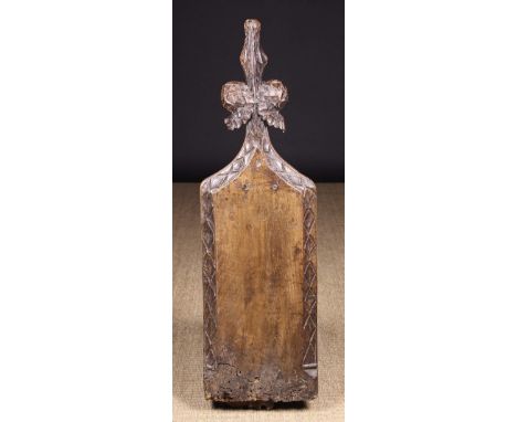 A 16th Century Carved Walnut Pew-end with Poppy-head Finial, 40 ins (102 cms) high, 12½ ins (32 cms) wide.