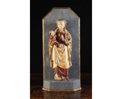 A Charming 16th Century Polychromed Relief Carving of Madonna & Child, Mechelen Circa 1520. Mary depicted with long flaxen ha