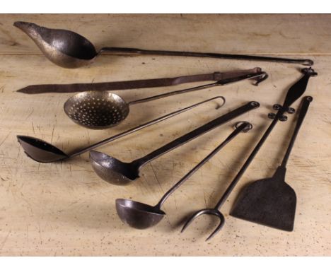 A Collection of 18th and 19th Century Ladles, Skimmers and Culinary Implements to include an Iron slice and Fork (8).