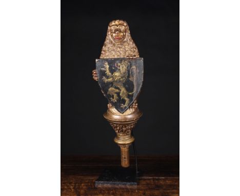 A Finely Carved late 16th/Early 17th Century Polychromed & Gilded Newel Post Finial in the form of a lion sejant-erect bearin
