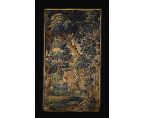 A Late 17th/Early 18th Century Verdure Tapestry Fragment depicting Grape Harvesters trampling fruit in a coopered vat set in 