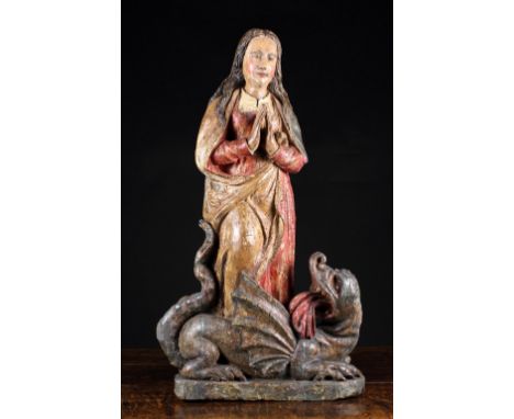 A 16th Century French Polychromed Wood Carving of Saint Marguerite & The Dragon, Lorraine, Circa 1520. Marguerite depicted wi