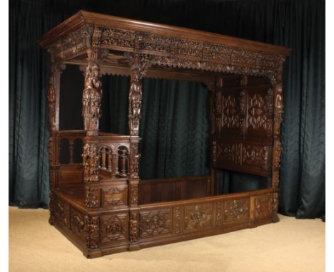A Fabulous Flemish Renaissance Style Bed richly carved with bands of putti riding sea-horses to the scalloped canopy rails an