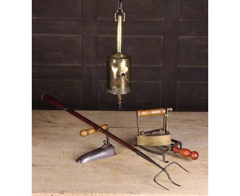 A 19th Century Brass Bottle Jack by W. Baily & Sons, an 18th century brass box iron, an 18th century ruffling iron, an antiqu