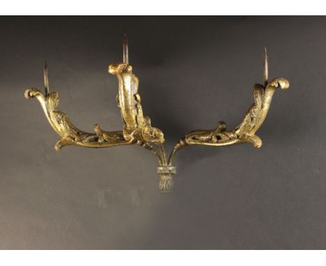 A Pair of 18th Century Italian Carved Giltwood Wall Sconces. Each having three foliate scroll arms emanating from an iron wal