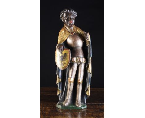 A Rare Late 15th Century German Polychromed Relief Carving of Saint Maurice dressed in armour with a dark blue lined gilt clo