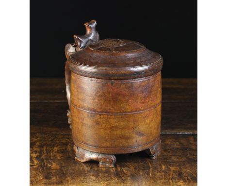 A Large 18th Century Norwegian Birchwood Peg Tankard. The domed lid centred by a roundel emblazoned with a lion and having an