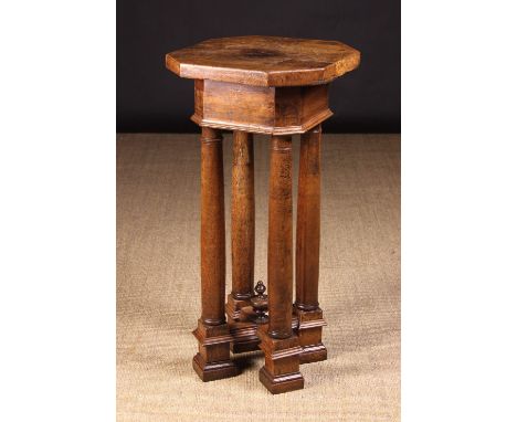 A Bologna Renaissance Style Walnut Sculpture Stand. The thick octagonal top on four columnar supports leading down to a cruci