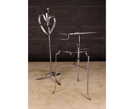 A 19th Century Steel Lark Spit on a tripod base, 25 ins (64 cms) in height, and a 19th century steel trivet with an adjustabl