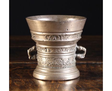 A 17th Century Dutch Bronze Mortar, cast with a band of text to the rim inscribed ' LOF GODT VAN AL. ANNO 1661 above two band