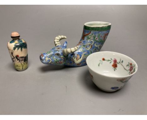 A Chinese famille rose cup, an ox rhyton cup and an enamel on copper snuff bottleCONDITION: The tea bowl has a fine chip to t