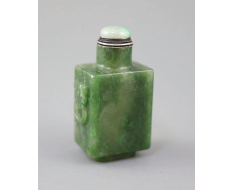 A good Chinese spinach green jade rectangular snuff bottle, 18th/19th century, the sides carved in relief with a pair of lion