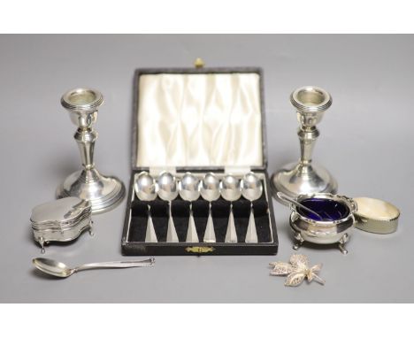 A pair of modern silver dwarf candlesticks, London, 1977, 10.6cm, weighted, two silver condiments, one salt spoons, one sterl