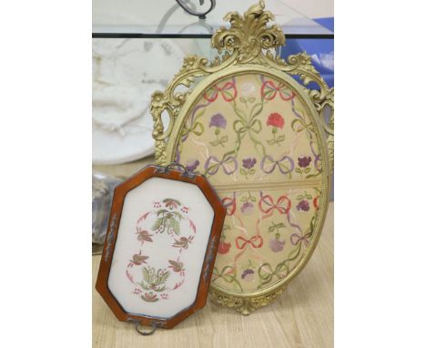 An oval needlework panel and another, largest 39 x 59cm