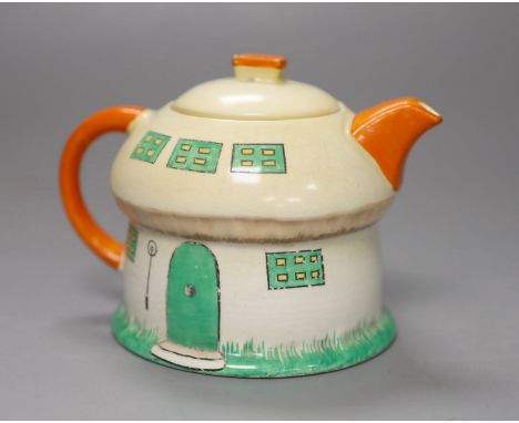 A Shelley Mabel Lucie Attwell toadstool teapot, height 11cmCONDITION: Neck rim flange very small chip, no doubt caused by cov