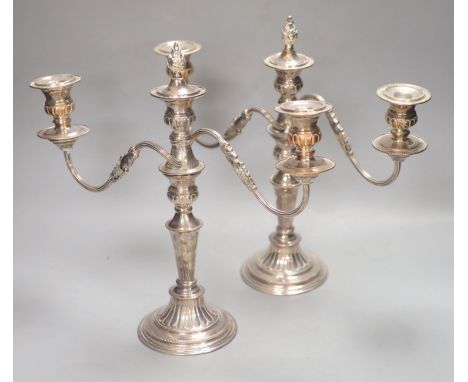 A pair of plated two branch candelabra, height 34cm