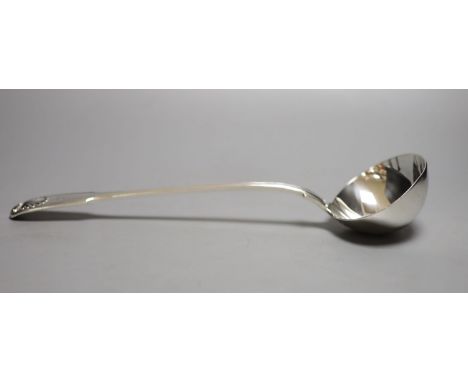 A Victorian silver fiddle, thread and shell pattern sauce ladle, Elizabeth Eaton, London, 1855, 33.5oz, 9.5oz, with engraved 