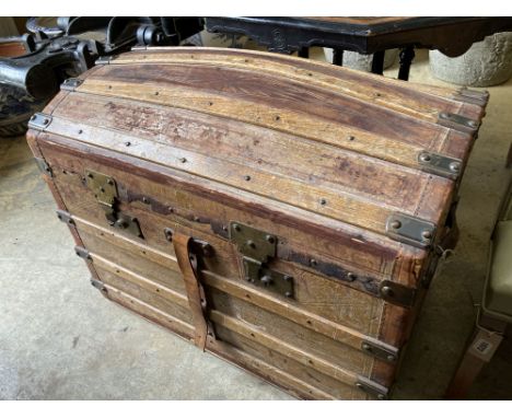 A late Victorian domed top travelling trunk, length 86cm, depth 52cm, height 64cm
