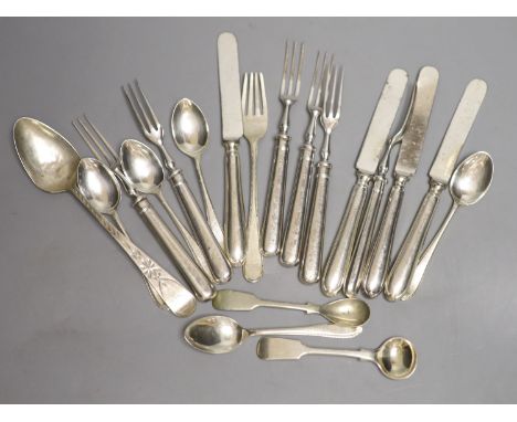 A set of six silver handled dessert forks, four silver handled dessert knives, a Georgian silver dessert fork, five silver te