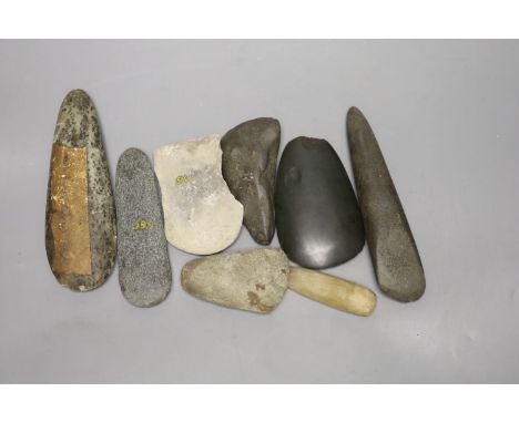 A group of stone adze hand tools, three 19th century Papua New Guinea, each labelled New Guinea, collected before 1950, the l