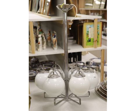 An Art Deco chrome six branch electrolier with white glass shades