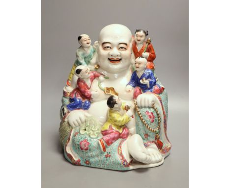 A large Chinese famille rose figure of Budai and children, mid 20th century, height 28cmCONDITION: Structurally good, althoug