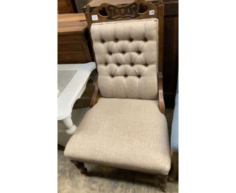 A late Victorian Art Nouveau salon chair, upholstered in buttoned natural fabric, width 60cm, depth 76cm, height 102cm