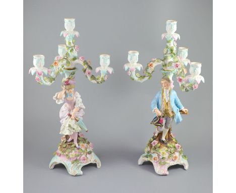 A pair of early 20th century Plaue porcelain figural candelabra, overall height 48cmCONDITION: Female - her right forearm pro
