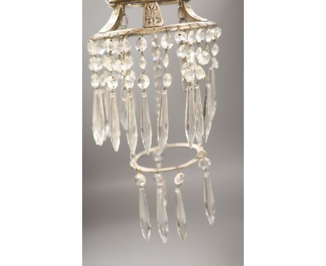A plated ceiling light hung with clear glass drops