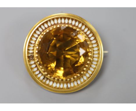 A Victorian yellow metal, citrine(chipped) and white enamel set target pendant brooch, 37mm, gross 16.6 grams (enamel a.f.).