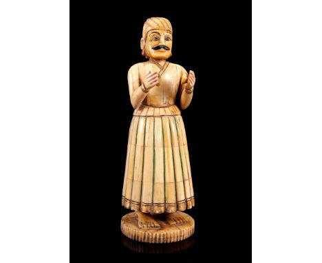 Ivory sculpture of a standing man with 2 singing bowls, India ca.1875, 21 cm, 566 grams. With certificate