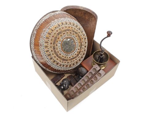 Box with wooden bowl, African wooden busts of man and woman, lap coffee grinder, wooden molds for chocolate and biscuits, and