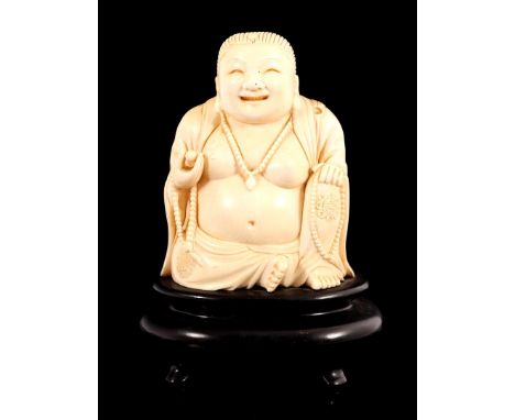 Richly carved ivory statue of a seated Buddha, China, c. 1880, 19 cm high, 1260 grams. With certificate