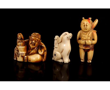 3 richly carved ivory Netsuke, seated man, standing person and dog with cub, Japan, Meiji Period ca.1900, 3.5, 3.5 and 5.2 cm