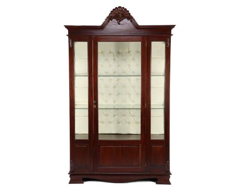 Mahogany 1-door porcelain cabinet with facet cut panes, ornaments, decorated crest, upholstered back wall and lighting 219 cm