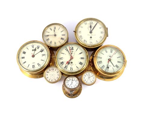 8 ship clocks in brass case including Hamilton Lancaster USA, H Prosser Glasgow, Royal Navy England, Smiths Empire, Thomas Me