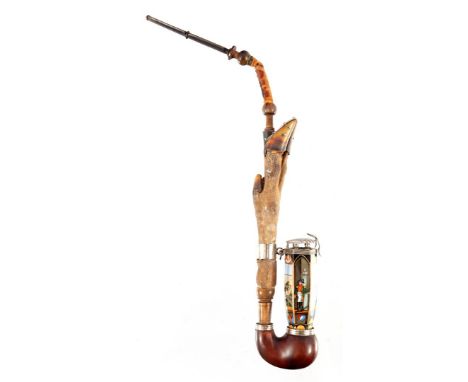 Antique porcelain tobacco pipe with high rear bowl on a weighted bottom, pipe type is cuff, head measures 8x3.5 cm, and decor