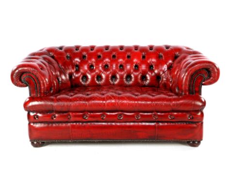 Chesterfield sofa with red leather, 172 cm wide (restored spot on armrest)