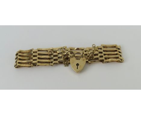 A 9ct gold five bar gate bracelet, with a heart padlock, 11.48g gross