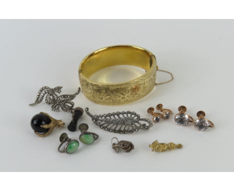 A 9ct gold charm in the form of a claw holding a black hardstone sphere, two pairs of white paste stone set screw on earrings