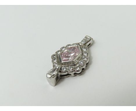 An unusual natural fancy pink and white diamond pendant, the elongated hexagonal step cut light pink diamond in a rub-over se