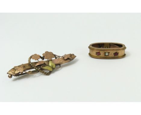 An early 20th century 9ct rose gold brooch decorated with flowers and with yellow gold accents, and a 9ct rose gold scarf cli