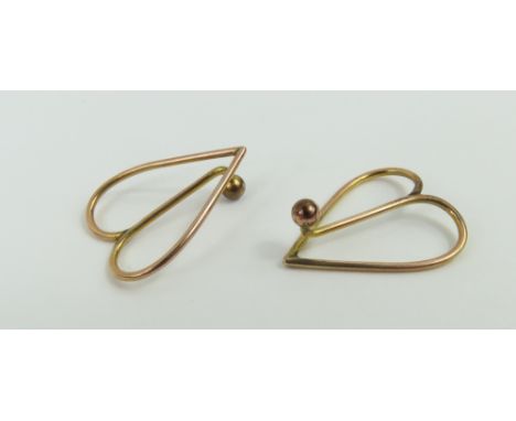 A pair of Edwardian collar/tie clips, with plain gold ball terminals, acid tests as approximately 9ct gold, 1.59g gross, in a