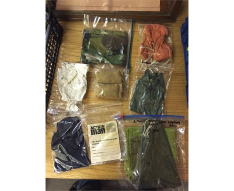 A volume of vintage Action Man accessories to include tent, sleeping bags, sand bags, life vest, two further uniforms and an 
