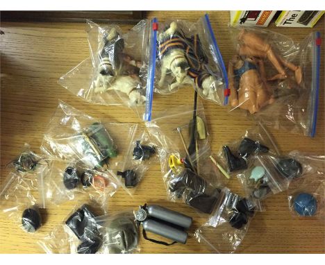 A volume of vintage Action Man accessories, an Eagle Eye Action man in component parts, four huskies and various headwear.